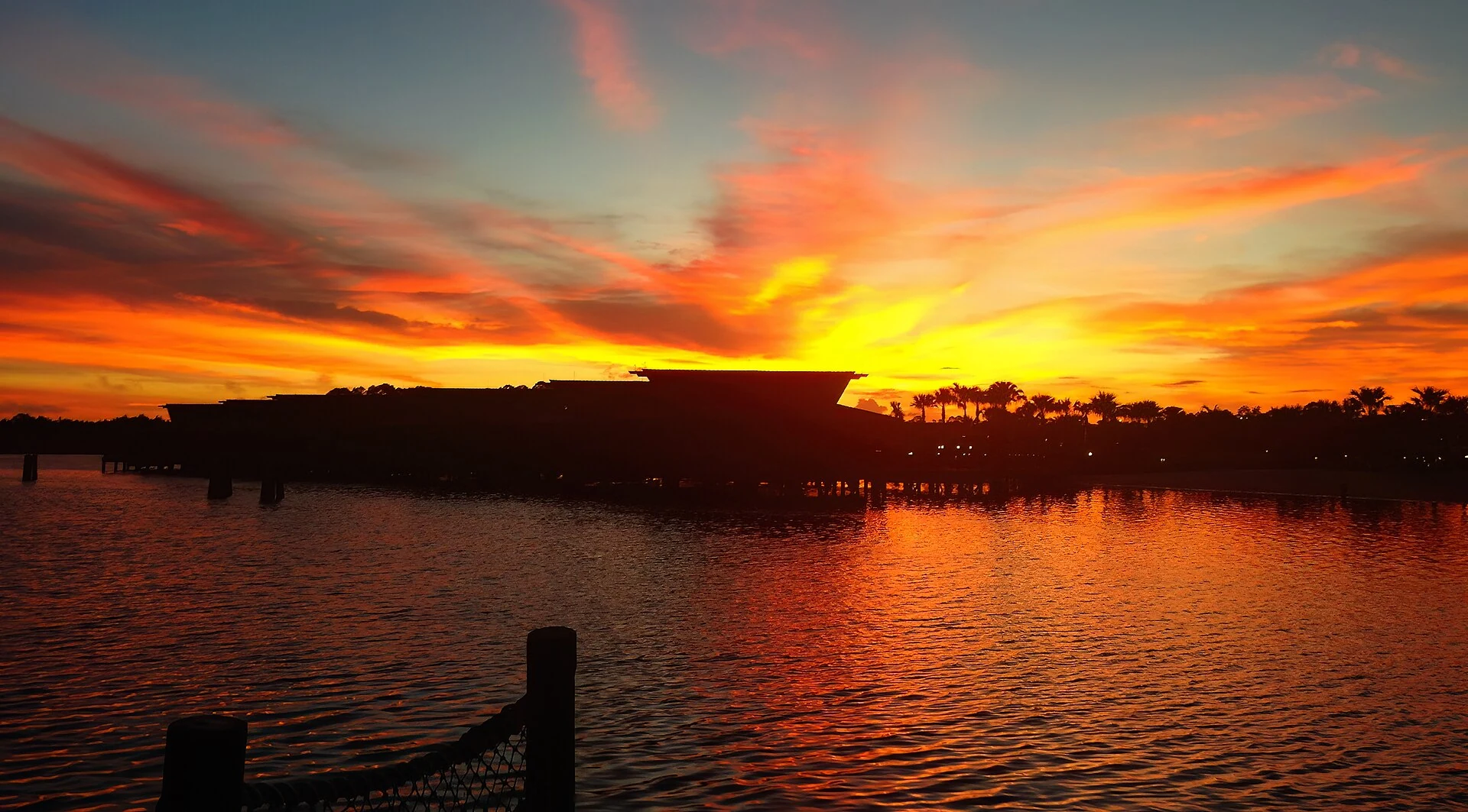 A historical Walt Disney World waterfront at sunrise in 2015, not Lakeshore Lodge