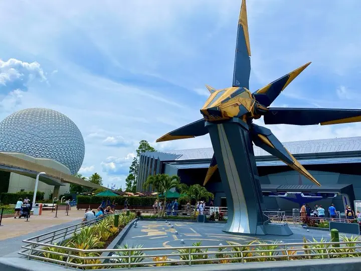 The Starblaster ship outside Cosmic Rewind with Spaceship Earth behind it at EPCOT