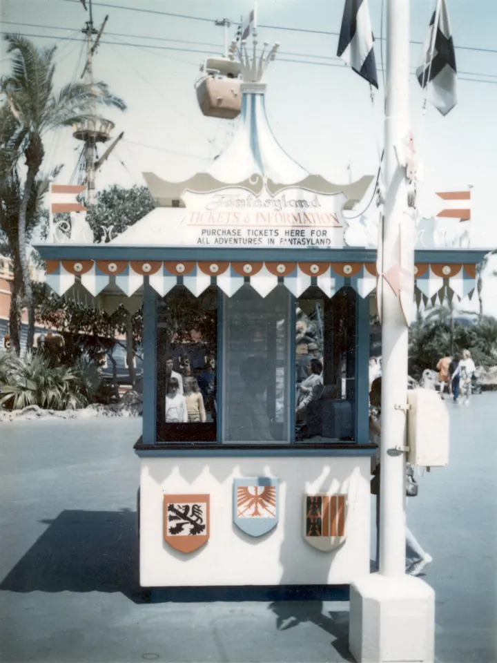 A 1960s Fantasyland ticket booth at Disneyland, with a sign reading Tickets and Information